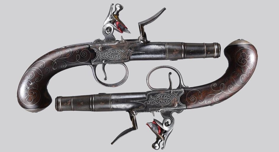 A pair of 18th century English 54 bore flintlock pistols, three stage turn off barrels...