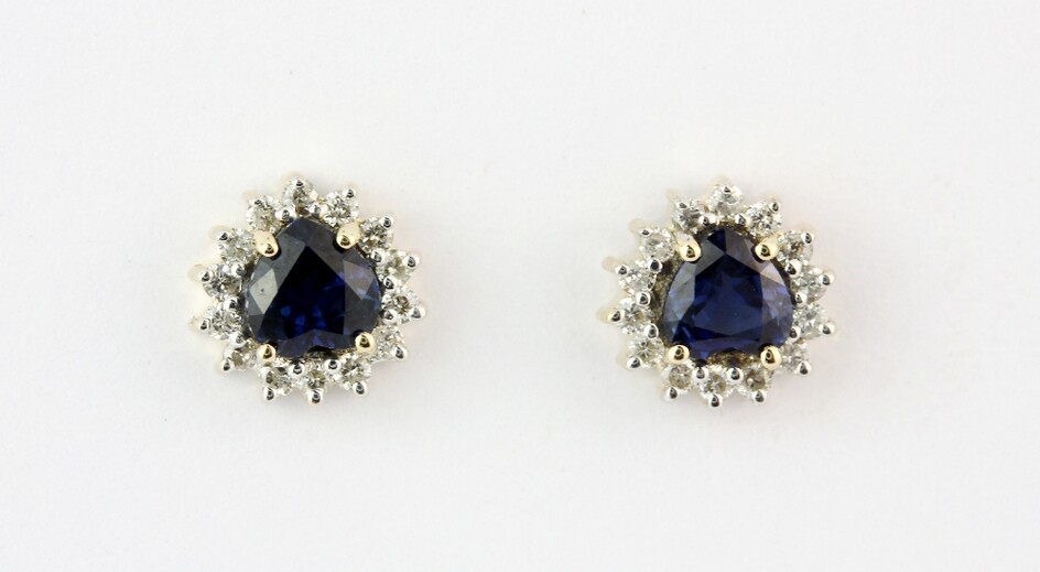 A pair of 9ct yellow gold (stamped 9k) stud earrings set with heart shaped sapphires surrounded by diamonds, L. 0.7cm.