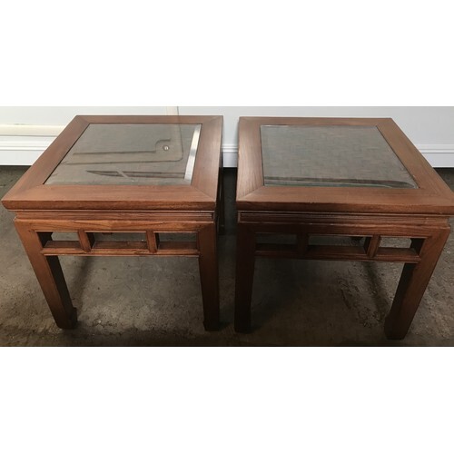 A pair of Chinese side tables with lattice work top under gl...