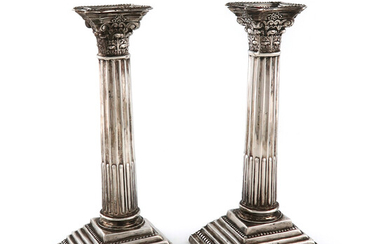 A pair of Edwardian silver candlesticks