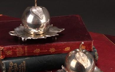 A pair of Elizabeth II silver novelty condiments and stands,...