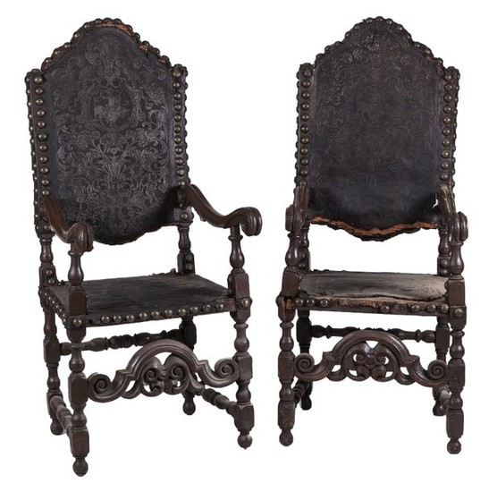 A pair of Portuguese leather upholestered chairs, 17th...