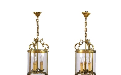 A pair of circular glazed brass hall lanterns. 20th century,...
