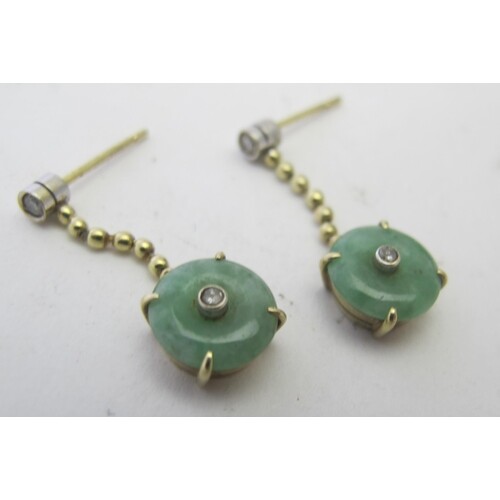 A pair of jade & diamond drop earrings, the circular jade in...