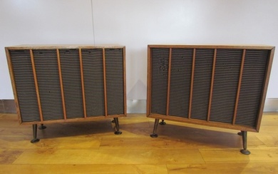 A pair of mid-20th Century oak cased speakers raised on roun...