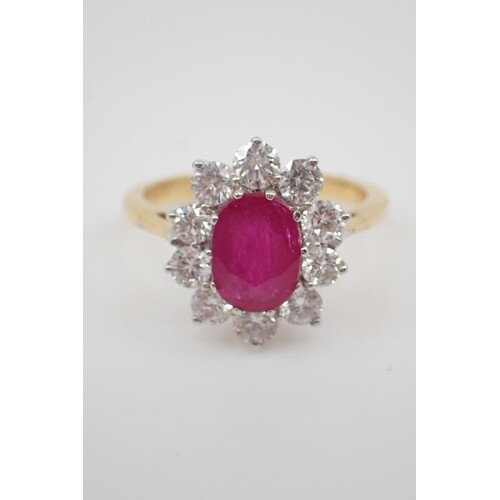 A ruby and diamond cluster ring, the ruby is estimated as 1....