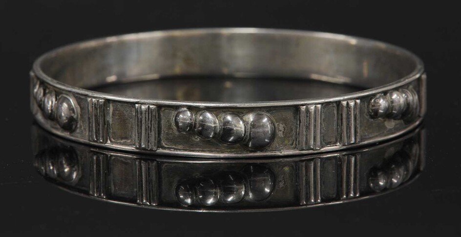 A sterling silver slave bangle by H G Murphy
