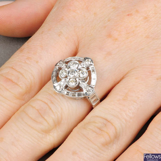 A vari-cut diamond openwork cluster ring. Estimated