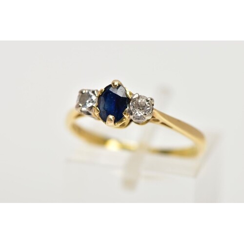 AN 18CT GOLD SAPPHIRE AND DIAMOND THREE STONE RING, centring...