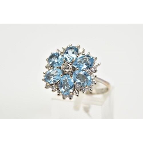 AN 18CT WHITE GOLD AQUAMARINE AND DIAMOND CLUSTER RING, the ...