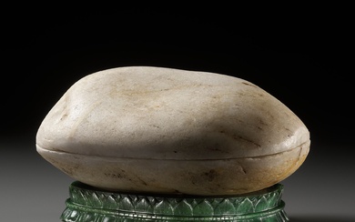 AN ANCIENT WHITE PEBBLE ‘KAPALA’ BOX AND COVER, WITH A FITTED SPINACH-GREEN JADE STAND, IMPERIAL...