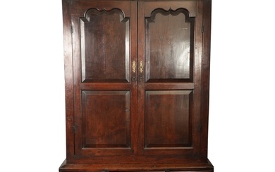 AN EARLY 18TH CENTURY JOINED OAK WELSH CUPBOARD with moulded...