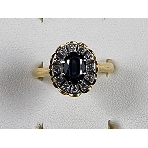 An 18ct gold sapphire and diamond cluster ring, stamped Star...