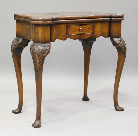 An early 20th century George I style walnut fold-over card table, fitted with a drawer, on cabriole