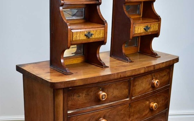 An early Victorian mahogany bowfront chest, with two short and...