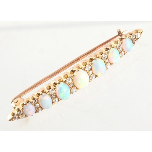 An unmarked yellow gold opal & diamond bar brooch, set with ...