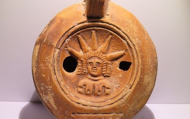 Ancient Roman Terracotta Oil Lamp with the god Helios with inscription on the base. 11 cm Large. Intact.
