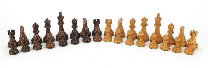 Carved and turned wooden chess set with beize lined