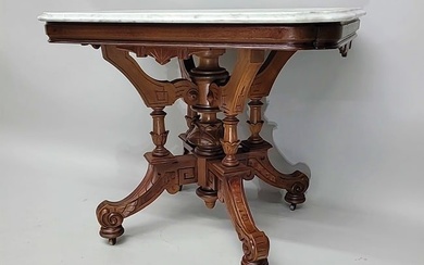 Circa 1875 Burl Walnut American made Renaissance Revival marble top parlor table with extensive