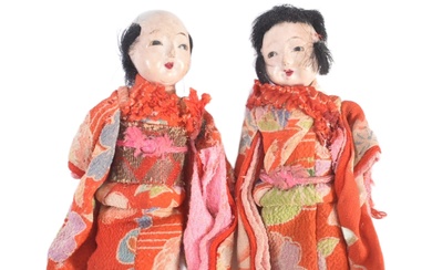 Dolls - two late 19th / early 20th century composition Japanese dolls. Composition heads and limbs with traditional costumes. Both with inlaid black hair and inset glass eyes. One doll with damage to feet, otherwise complete. Each measures approx; 8cm...