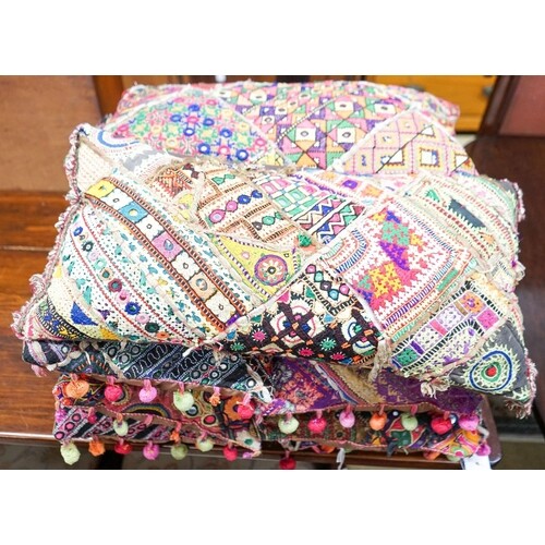 Eight Indian embroidered cushions, 60 x 30cm