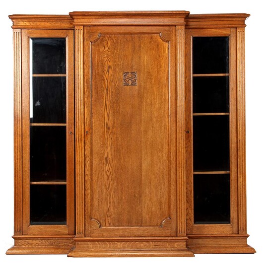 (-), Oak cabinet with carved decor and faceted...