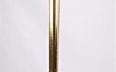 Floor lamp in bronze and brass resting on...