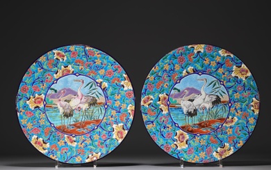Longwy - Pair of large enameled plates decorated with cranes.