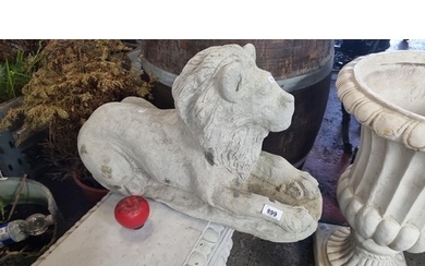 Lot: 899 - Cast Stone Recumbent Lion Sculpture A vintage wea...