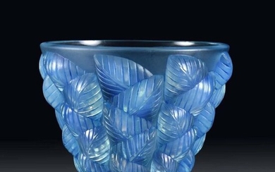 Moissac' Opalescent Art Deco glass vase with raised geometric leaf design around the circumference heightened with blue staining, signed R Lalique. Circa 1930. Height 13 cm.