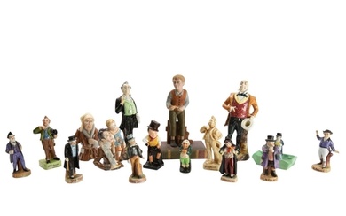 PORCELAIN FIGURES. A collection of Dickens character figures...