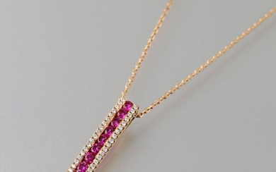 Pendant and its chain with chainmail forçat, out of yellow gold 750 thousandths, it is set with a line of nine rubies cut round between two lines of modern cut diamonds.