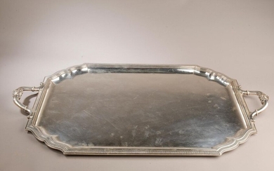Rectangular silver platter with curved recessed corners, edged with a...