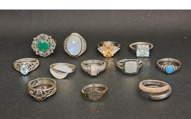 SELECTION OF TWELVE SILVER RINGS including a blue topaz sing...