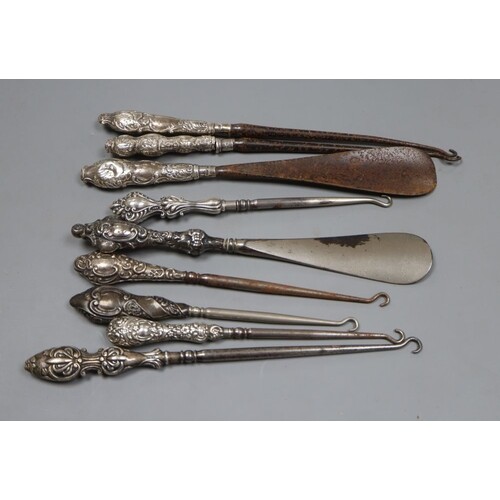 Seven assorted early 20th century silver handled button hook...