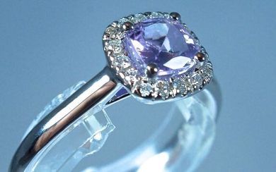 Stunning 18 kt white gold ring set with a certified 0.55 carat cushion cut Tanzanite and surrounded by brilliant-cut diamonds for a total of 0.11 carat. size (modifiable) 51 3.00 g. Unique piece, the ring is engraved and signed by its creator...
