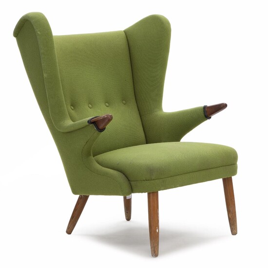 SOLD. Svend Skipper: Wingback chair with frame and "nails" of teak. Upholstered with green wool. – Bruun Rasmussen Auctioneers of Fine Art