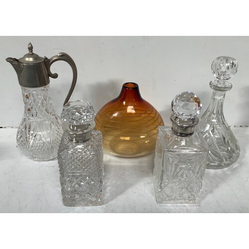 Three various glass decanters including one with silver coll...